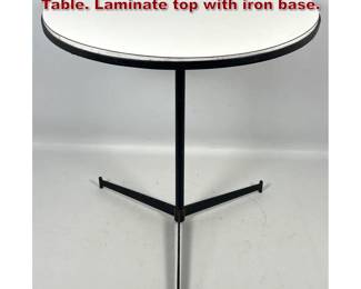 Lot 35 Paul McCobb Cigarette Side Drink Table. Laminate top with iron base.