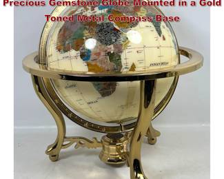 Lot 277 Tabletop Mother of Pearl and SemiPrecious Gemstone Globe Mounted in a Gold Toned Metal Compass Base