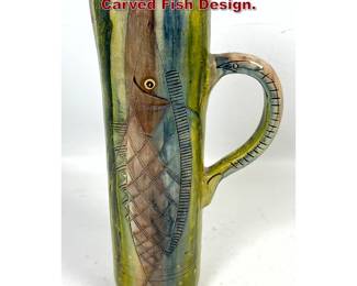 Lot 1024 Tall Picasso Style Pitcher with Carved Fish Design. 