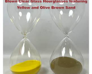 Lot 1153 Pair of Large Contemporary Hand Blown Clear Glass Hourglasses featuring Yellow and Olive Brown Sand