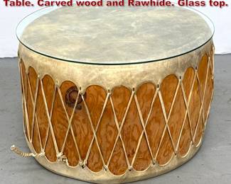 Lot 883 Large Taos Pueblo Drum Coffee Table. Carved wood and Rawhide. Glass top. 
