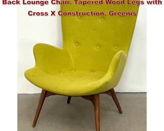 Lot 747 Contemporary Modern Sculpted Back Lounge Chair. Tapered Wood Legs with Cross X Construction. Greenis