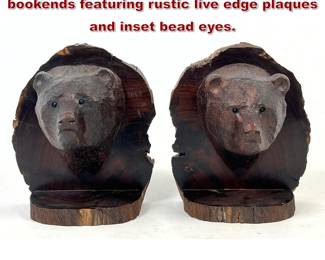 Lot 1060 Pr hand carved ironwood bear head bookends featuring rustic live edge plaques and inset bead eyes.