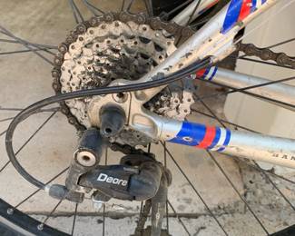 * Genuine Trek OCLV carbon frame. * Shimano Deore rear derailleur. * Bontrager Race Lite-style wheel. * Continental Trail King tires. * Older RockShox suspension fork (appears to be in good shape).