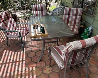 Patio Dining Set with Glass Top Table and Striped Cushioned Chairs