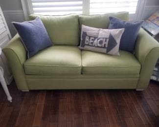 Celery green couch is a sleeper sofa