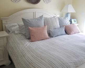 King bedroom suite: bed; two nightstands; tall dresser