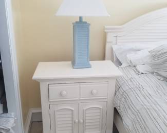 King bedroom suite: nightstand; table lamp