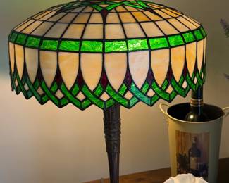 Tiffany style lighted glass lamp with brass