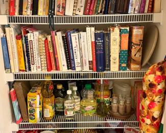 Collection of cookbooks and cooking accessories