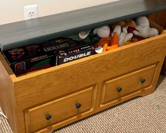 Toy box filled with toys and board games
