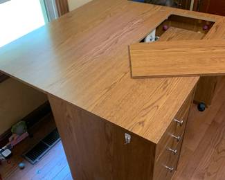 #145	laminate sewing machine table with manual lift 5 drawers lift table on wheels 42x20-39x29	 $400.00 			