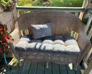 #167	plastic wicker love seat with blue cushion	 $100.00 			