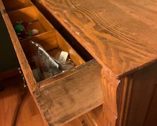 #154	oak dresser with 3 drawers on wheels  divider in top drawer 43x20x33	 $150.00 			