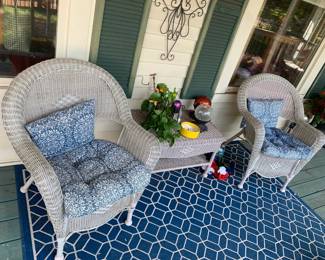#168	(2) plastic Wicker chairs with cushion and table 	 $80.00 			
