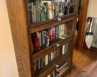 #093	4 door barrister book case 1 piece with top leaded glass door glass knobs 35x13x59	 $200.00 