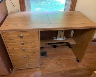 #145	laminate sewing machine table with manual lift 5 drawers lift table on wheels 42x20-39x29	 $400.00 			