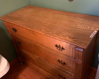 #154	oak dresser with 3 drawers on wheels  divider in top drawer 43x20x33	 $150.00 			