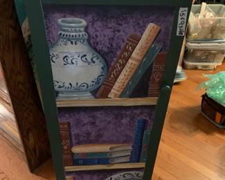 #095	1 door 3 shelf cabinet painted with book shelf on door 15x9x40	 $100.00 			