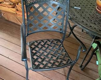 #005	black iron round table with 4 chairs with cushion 48x29 	 $350.00 			