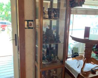 #042	display cabinet with 4 shelves lighted side entry on left 18x14x72	 $65.00 			