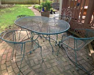 #004	oval metal table green with 4 chairs 60x39x30	 $175.00 			