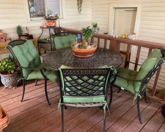 #005	black iron round table with 4 chairs with cushion 48x29 	 $350.00 			