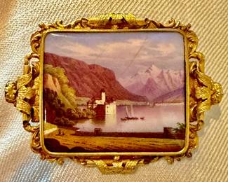 An exceptional solid 18K yellow gold hand made high Victorian Swiss Miniature landscape pin depicting the Chateau de Chillon.