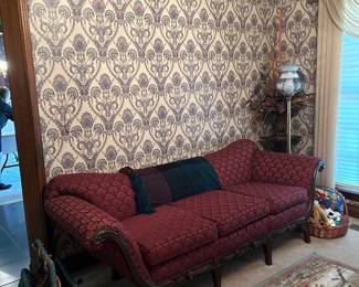 Antique mahogany sofa, equestrian rug