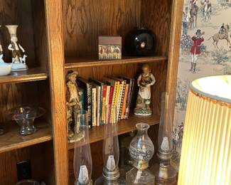 Hurricane lamps, books, Western decor