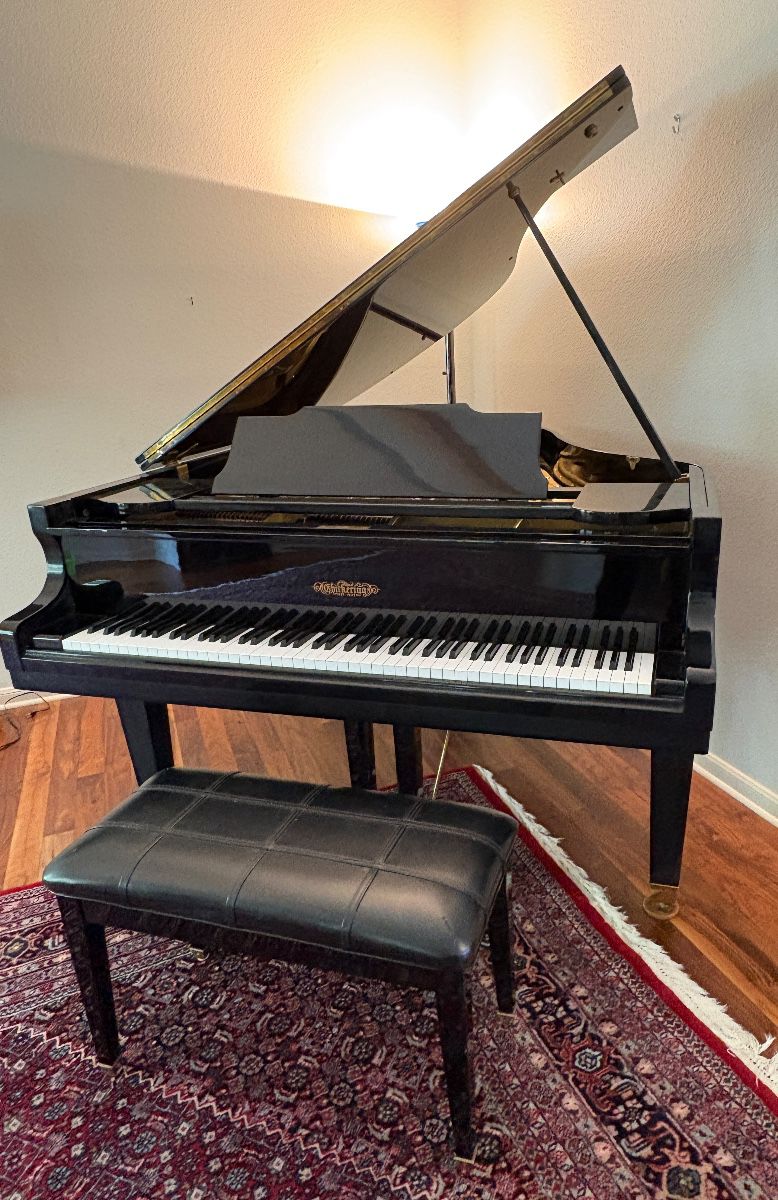 Chickering & Sons 5’9” Grand Piano. This stunning piano features 88 keys, three pedals, rare single-strand stringing and matching bench.
