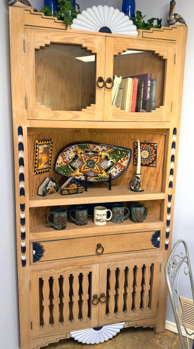 Southwest-inspired wooden corner cabinet, Talavera pottery