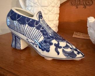 Vintage blue and white porcelain decorative shoe figurine.