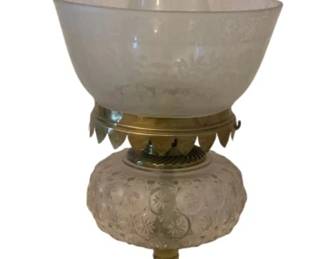 212 - Oil Lamp 21" (Description): Oil lamp measuring 21 inches in height.  Features a clear glass chimney, frosted  etched glass shade with floral design,  pressed glass font, hand-painted porcelain  stem with floral decoration, and brass fittings on a square base.