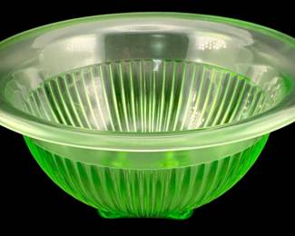 392 - Uranium Green Glass Mixing Bowl 4.25"x9.5" (Description): Uranium glass mixing bowl featuring a ribbed  design. Measures 4.25 inches in height by 9.5  inches in diameter.
