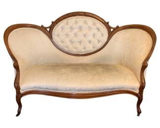108 - Antique Victorian Cameo Back Settee 36"x60"x32" (Description): Vintage sofa featuring carved wood frame with  tufted oval medallion back and curved arms.  Measures 36 inches high by 60 inches wide by  32 inches deep.