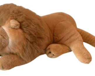 77 - America Wego Plushed Stuffed Lion 24"x11"x13" (Description): American Wego lion plush toy. Measures 24  inches long by 11 inches wide by 13 inches  tall.