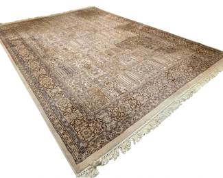 676 - Large Rug 82"x119" (Description): Large rug measuring 82" x 119". Features a  traditional panel design with decorative  motifs throughout the central field,  surrounded by an ornate border. Finished with  fringe at both ends.