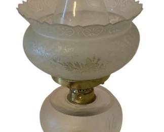 220 - Oil Lamp 20" (Description): Oil lamp measuring 20 inches in height.  Features a glass chimney, decorative frosted  glass shade with scalloped edge and etched  floral design, frosted glass font with etched  decoration, and an ornate pressed glass base with brass burner fitting.