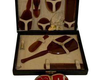 724 - 2 Vintage Grooming Sets (Description): A lot of two vintage grooming sets. The  collection includes coordinating vanity and  personal care accessories suitable for travel  or dressing table use.