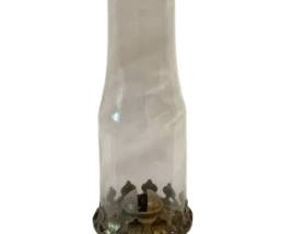 632 - Amber Glass Oil Lamp 16" (Description): Oil lamp featuring an amber glass base with  embossed decorative pattern and a clear glass  chimney. Measures 16 inches in height.