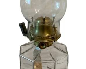 631 - Oil Lamp 17.5" (Description): A classic oil lamp featuring a clear glass  chimney and font with a brass burner  assembly. The lamp has an octagonal glass  base and font design. Measures 17.5 inches in  height.