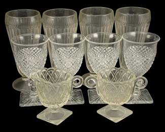 403 - Assorted Glass Items (Description): A lot of assorted glass items including  various drinking glasses and decorative  pieces in pressed glass patterns.