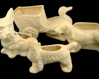 425 - 4 Ceramic Animal Planters (Description): A lot of four ceramic animal planters. Each  planter features a different animal figure  design in a cream-colored glaze, suitable for  small plants or decorative display.
