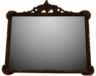 194 - Mirror 35 x 38" (Description): A mirror measuring 35 inches by 38 inches.  The frame features ornate carved decorative  details with scrollwork at the corners and an  elaborate crest at the top center.
