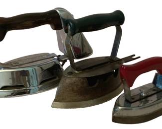 186 - 3 Vintage Irons (Description): A lot of three vintage irons. The collection  showcases different styles and eras of iron  design, each with distinct handles and  construction.