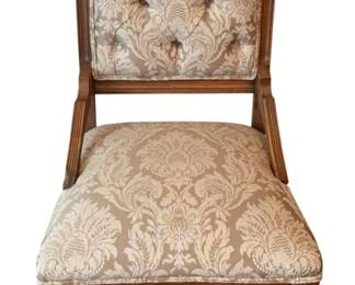 56 - Antique Chair 36"x19"x18" (Description): Antique chair featuring carved wooden frame  with decorative crest rail and tufted  upholstered back. The seat and back are  upholstered in coordinating fabric. Supported  on turned front legs. Measures 36 inches high by 19 inches wide by 18 inches deep.