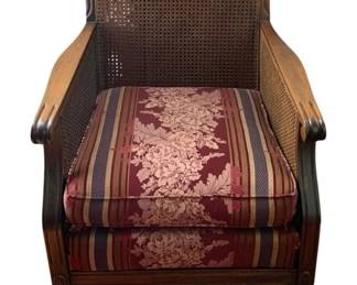 35 - Vintage Chair 35"x26"x25" (Description): Vintage chair featuring cane back and side  panels with carved wood frame. Includes  upholstered seat cushion. Measures 35 inches  high by 26 inches wide by 25 inches deep.
