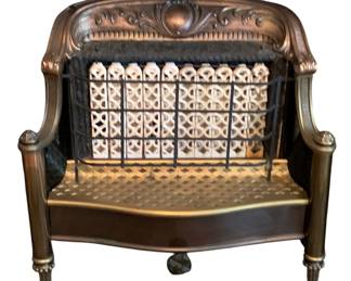 68 - Humphrey Co. Gas Heater 22"x23"x10" (Description): Vintage gas heater manufactured by the  Humphrey Co. The heater features an ornate  copper-toned frame with decorative scrollwork  and ceramic radiant elements behind a  protective grate. Measures 22 inches by 23 inches by 10 inches.