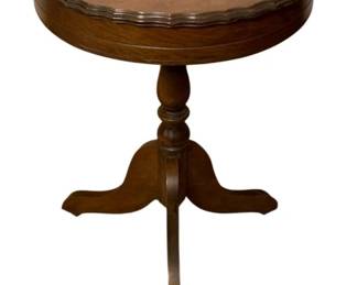 772 - Wood Pedestal Table 24.5"x17" (Description): A wood table featuring a round top with  scalloped edges, a turned pedestal, and  tripod base. Measures 24.5" x 17".